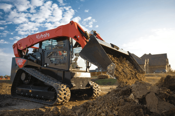 Track Loader dumping dirt