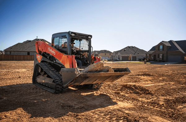 Track Loader moving slabs of concrete