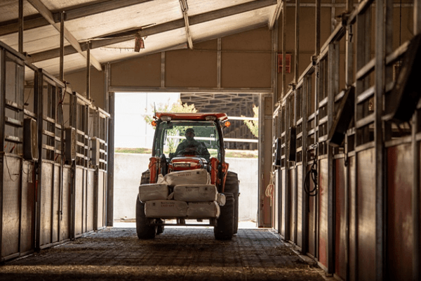 Tractor moving heavy materials