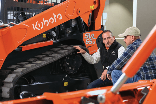 Employee showing a Kubota Track Loader