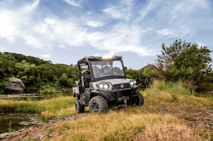 RTV driving around lake