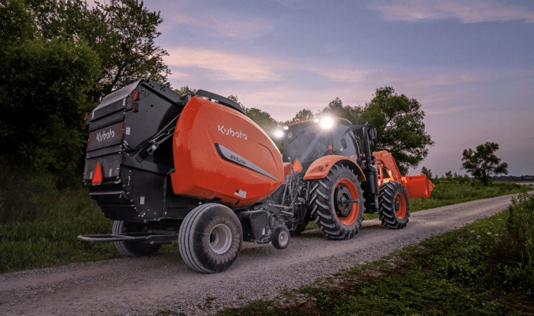 Hay baler attached to tractor