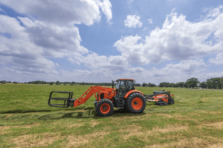 Tractor with mowing with disc mower