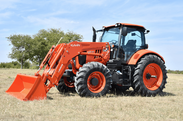 A large farming tractor in a field