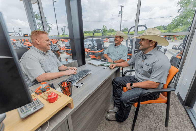 People consulting in a dealership office